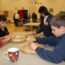 grade 5 students work on creating their hand drum